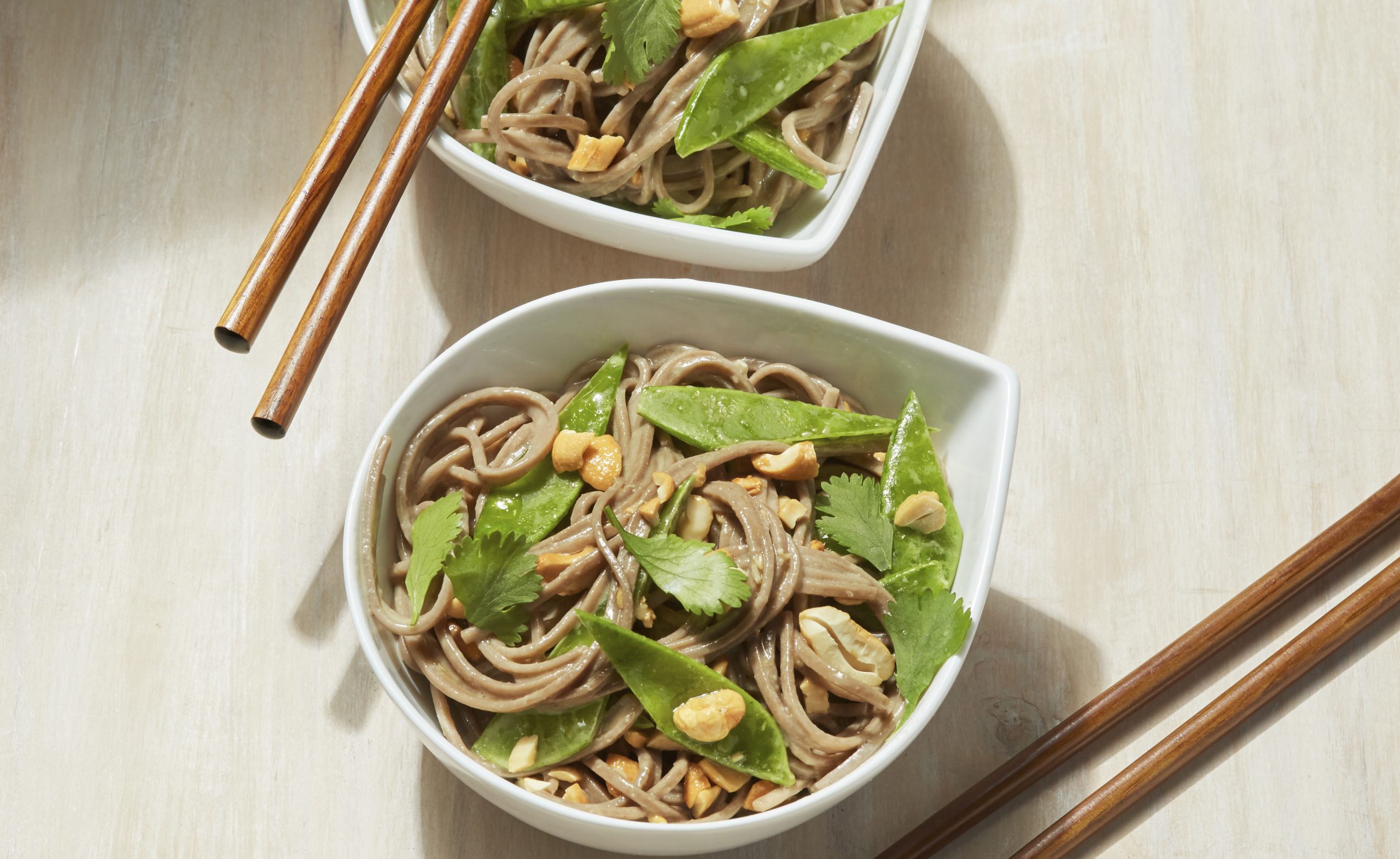 Bowl of soba noodle salad with chopsticks