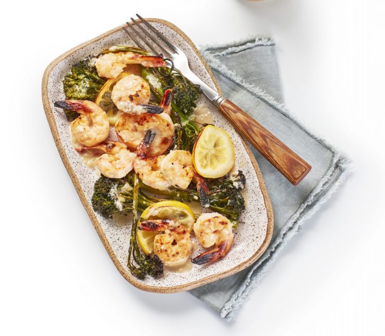 shrimp with broccolini and lemon on a plate