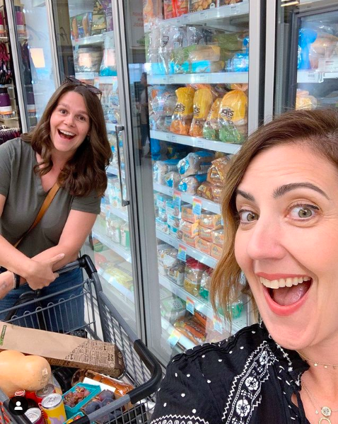 stacie billis and meghan splawn from didn't i just feed you podcast shopping at a grocery store