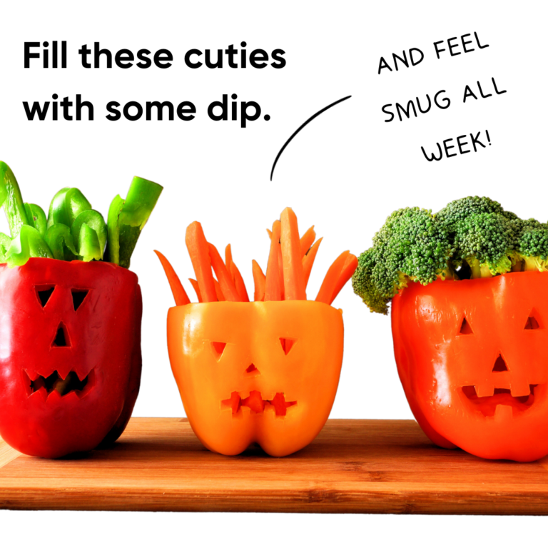 bell peppers carved like jack o' lanterns and filled with a yogurt and not just pesto dip